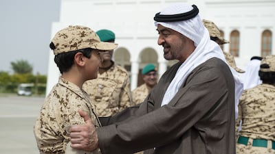 Sheikh Mohamed speaks to a young guest before his departure