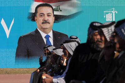 A poster of Iraq's Prime Minister Mohammed Shia Al Sudani in Najaf. AFP