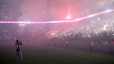 Salah takes photos of the crowd as they greet him. Reuters