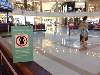 A 2021 dress code sign at Dubai Marina Mall. The National