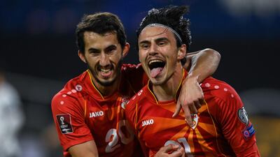 Eljif Elmas (r) celebrates next to Stefan Spirovski after netting the winner. EPA