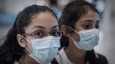 Hong Kong pupils wear masks as a precaution against Mers. Measures have spread far beyond South Korea. Philippe Lopez / AFP