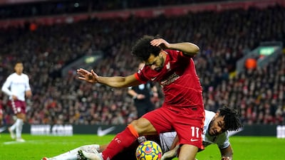 Liverpool's Mohamed Salah is fouled by Aston Villa's Tyrone Mings that leads to the match-winning penalty. AP