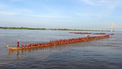 The world's longest dragon boat carrying 179 rowers sails along the Mekong river. AFP