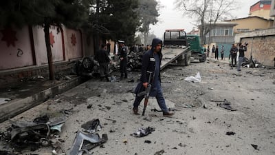 Security personnel inspect the site of a bomb attack in Kabul. Three separate explosions in Afghanistan's capital on Saturday killed and wounded numerous people. AP