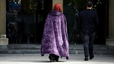 A mourner wearing Harry Potter themed cloak. Reuters