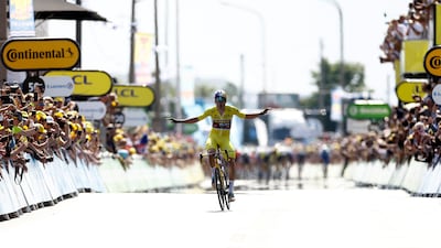 Jumbo-Visma's Wout Van Aert celebrates as he crosses the finish line to win Stage 4. Reuters