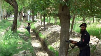 Pakistani policemen cordon off an area in Hangu near the border with Afghanistan. At least 16 troops were killed in an ambush in Hangu on July 13, 2008, an area in the "settled" parts of the North West Frontier Province.