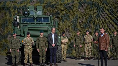 Prince William listens as Mr Blaszczak makes a speech in Warsaw. Getty