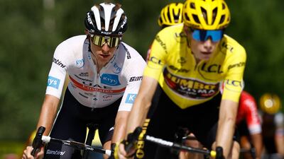 Jumbo-Visma's Jonas Vingegaard and Tadej Pogacar of UAE Team Emirates cross the finish line after Stage 16. Reuters