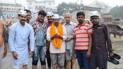 Arvind Kejriwal wades into the river Ganges in Varanasi on Tuesday as he announced plans to stand against election front-runner and opposition leader Narendra Modi in the city. AFP