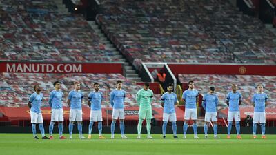 Manchester City players observe a minute of silence prior to kick off in memory of Colin Bell. Getty