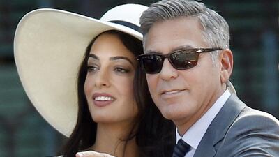 George Clooney and Amal Alamuddin appear to be the perfect couple. Luca Bruno / AP