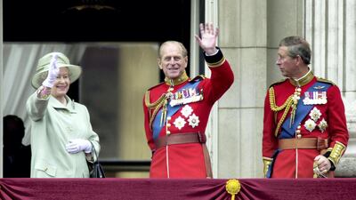 Queen Elizabeth, Prince Philip and Prince Charles wave from the balcony of Buckingham Palace during the Trooping of the Colour in 2001. Harvey/Getty Images