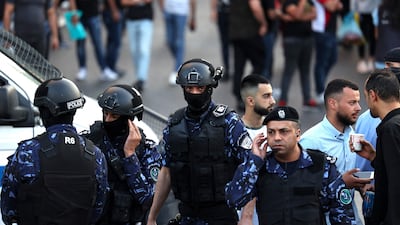 Palestinian police prevent demonstrators from gathering following the death of activist Nizar Banat, on July 5, 2021. AFP