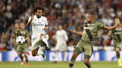 Real Madrid’s Marcelo fights for the ball against Legia’s Vadis Odjidja. Daniel Ochoa de Olza / AP Photo
