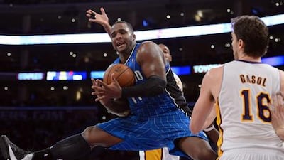Orlando Magic's Jameer Nelson is fouled as he gets between the Lakers' Chris Duhon and Pau Gasol.