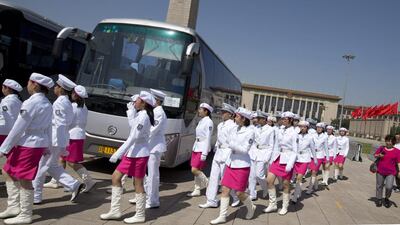 High school students in uniforms march on Tiananmen Square to stand at guard posts of Young Pioneers, a youth group under the Communist Party of China, around the Monument to the People's Heroes on Tiananmen Square in Beijing on May 29, 2014 photo. Twenty-five years after the Communist Party’s attack on demonstrations centred on Tiananmen Square on June 4, 1989, it is little more than a distant tale to young Chinese. The ruling party prohibits public discussion and 1989 is banned from textbooks and Chinese websites. Alexander Yuan/AP Photo