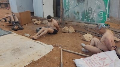 Palestinian men stripped, blindfolded and bound during an attack by Israeli settlers in Wadi Al Siq, near Ramallah in the occupied West Bank, in October 2023. Photo: Abu Hassan