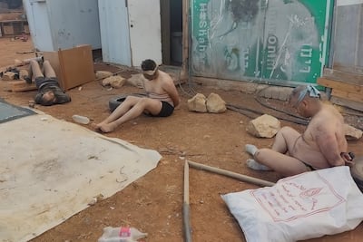 Palestinian men stripped, blindfolded and bound during an attack by Israeli settlers in Wadi Al Siq, near Ramallah in the occupied West Bank, in October 2023. Photo: Abu Hassan