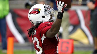 Chris Johnson of the Arizona Cardinals celebrates a touchdown run against the San Francisco 49ers in his team's NFL win on Sunday. Ross D Franklin / AP / September 27, 2015