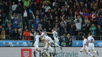 Slovenia's Benjamin Sesko celebrates with teeammates after scoring the second goal. Reuters