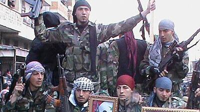 Members of the Free Syrian Army demonstrate against President Bashar Al Assad in the northern town of Maaret Al Numan yesterday.