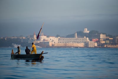 Fishermen pull in their catch into their small wooden boat a few hundred meters away from shore near Cape Coast, roughly 120km west of Ghana's capital Accra, on April 9, 2009. Olivier Asselin