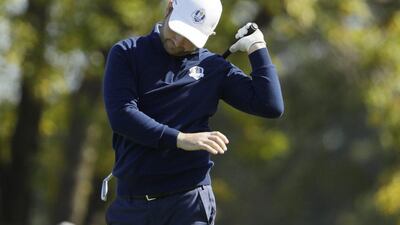 Europe’s Andy Sullivan reacts after hitting his tee shot in the water on the 17th hole during morning foursomes at the Ryder Cup. David J Phillip / AP Photo