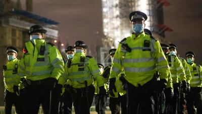 Police officers cross Westminster Bridge during the protests. Reuters