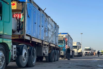 Lorries carrying portable toilets and humanitarian aid wait on the Egyptian side of the Rafah border crossing into Gaza. AFP