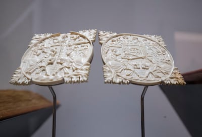 Mirror boxes made of ivory depicting tournament scenes, which draws links between knightly traditions of Europe and the Middle East at Louvre Abu Dhabi. Leslie Pableo / The National