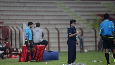 Ajman's head coach, Abdul Wahab Abdul Kader, is all smiles after his team scored a late winner courtesy of Boris Kabi. Lee Hoagland/The National