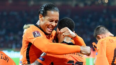 Netherlands' Memphis Depay celebrates scoring their second goal with Virgil van Dijk. Reuters
