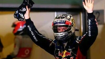 Sebastian Vettel waves to the crowd at the end of the race after a thrilling comeback drive at Yas Marina Circuit. Paul Gilham/ Getty Images