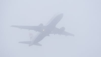 A British Airways aircraft taking off from London's Gatwick Airport on Saturday is almost obscured by fog. PA Wire