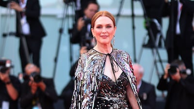 Julianne Moore attends the premiere of 'White Noise' at the 79th Venice International Film Festival in a black sequinned Valentino dress. Getty Images