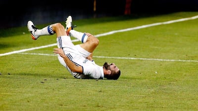 Real Madrid defender Dani Carvajal reacts to colliding with a Real Madrid player during the first half of the International Champions Cup match between FC Bayern Munich and Real Madrid at MetLife Stadium in East Rutherford, New Jersey, USA, 03 August 2016. Justin Lane / EPA