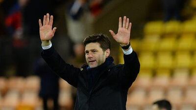 Spurs manager Mauricio Pochettino applauds the away supporters after their Premier League win on Tuesday night over Norwich. Tony Marshall / Getty Images