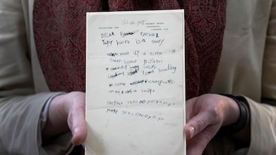 A letter written by Stephen Hawking and his sister Mary to their father when they were children. AP