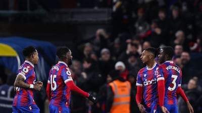 Michael Olise (2R) celebrates with teammates after scoring. AFP