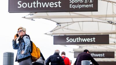 A Southwest traveller waits to check a bag before a flight at Denver International Airport. AFP