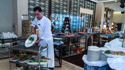 As well as preparing the meals, the chefts at Byblos Sur Mer are also in charge of presenting and removing the food pre and post iftar service. Victor Besa / The National