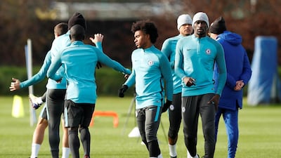 Willian, centre, believes Manchester City's form will make it hard for Chelsea to win the Premier League title. John Sibley / Reuters
