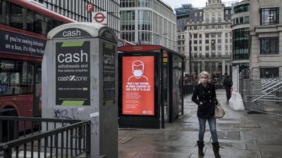 Members of the public walk near the River Thames and the City of London. Getty Images