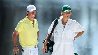 Rory McIlroy stands with ‘caddie’ Caroline Wozniacki ahead of the US Masters in April. Andrew Redington / AFP
