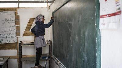 A pupil takes part in a classroom activity.