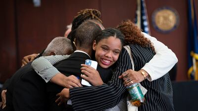 Aretha Franklin's granddaughter Grace Franklin, 17, embraces relatives after a Michigan jury's decision in a dispute over the singer's will. AP