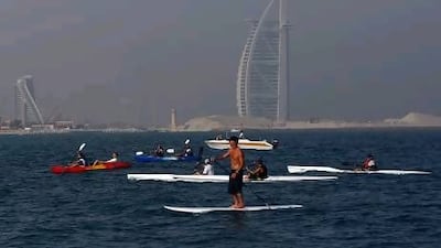 Hundreds of participants take part in the "Paddle for the Planet " event at the Kite Beach in Umm Suqeim.