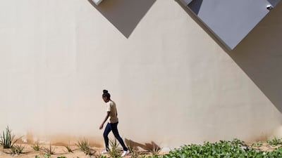 A visitor outside the Angola Pavilion, Expo 2020 Dubai. Serge Najjar/Expo 2020 Dubai